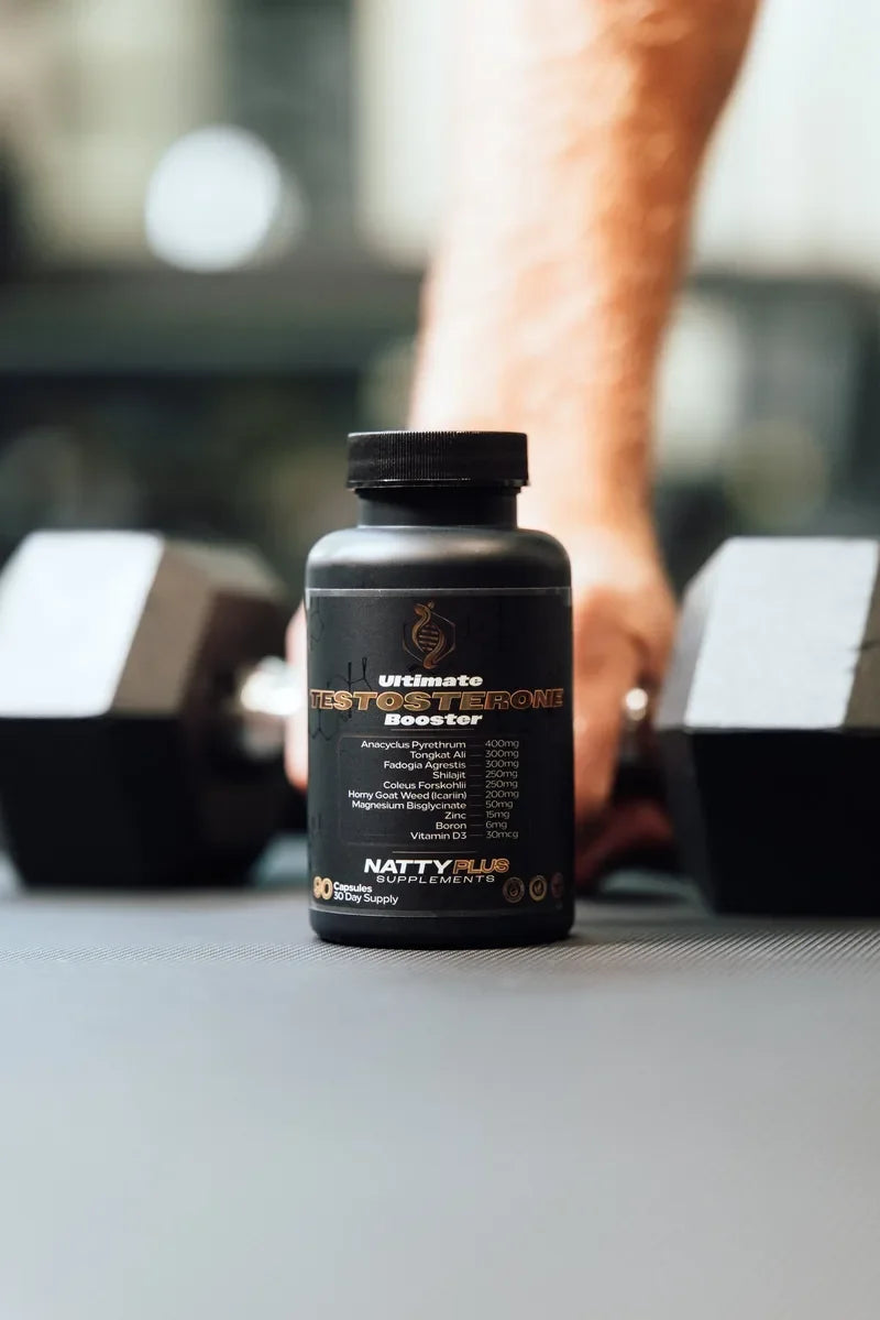 Ultimate Testosterone Booster between two dumbbells