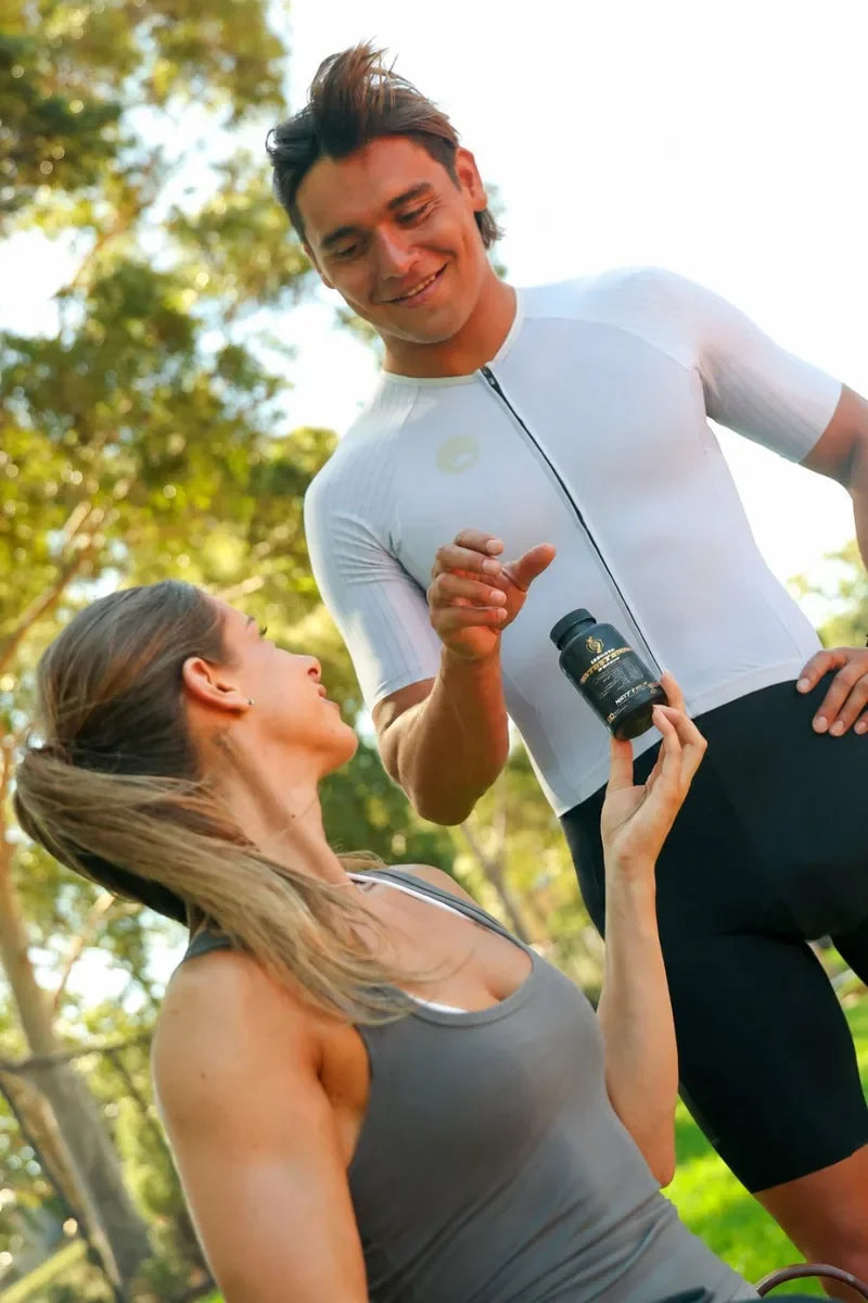 Woman handing him the Ultimate Testosterone Booster