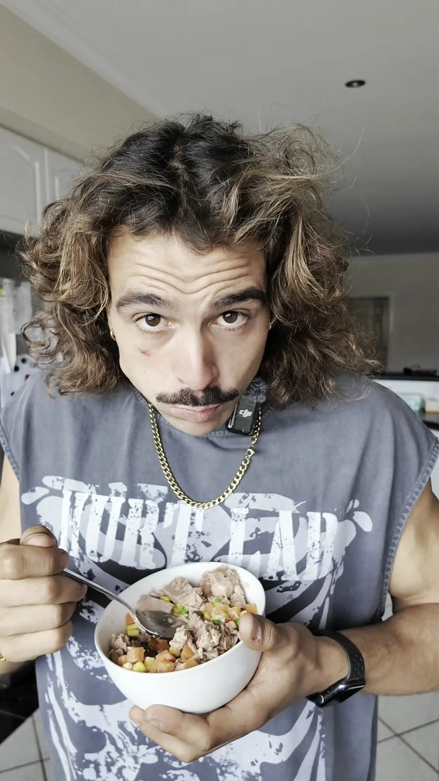 Rambo eating a bowl of food at home