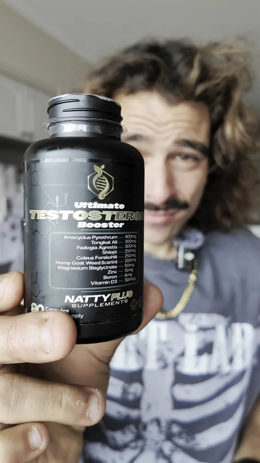 Rambo holding a bottle of the Ultimate Testosterone Booster up to the camera